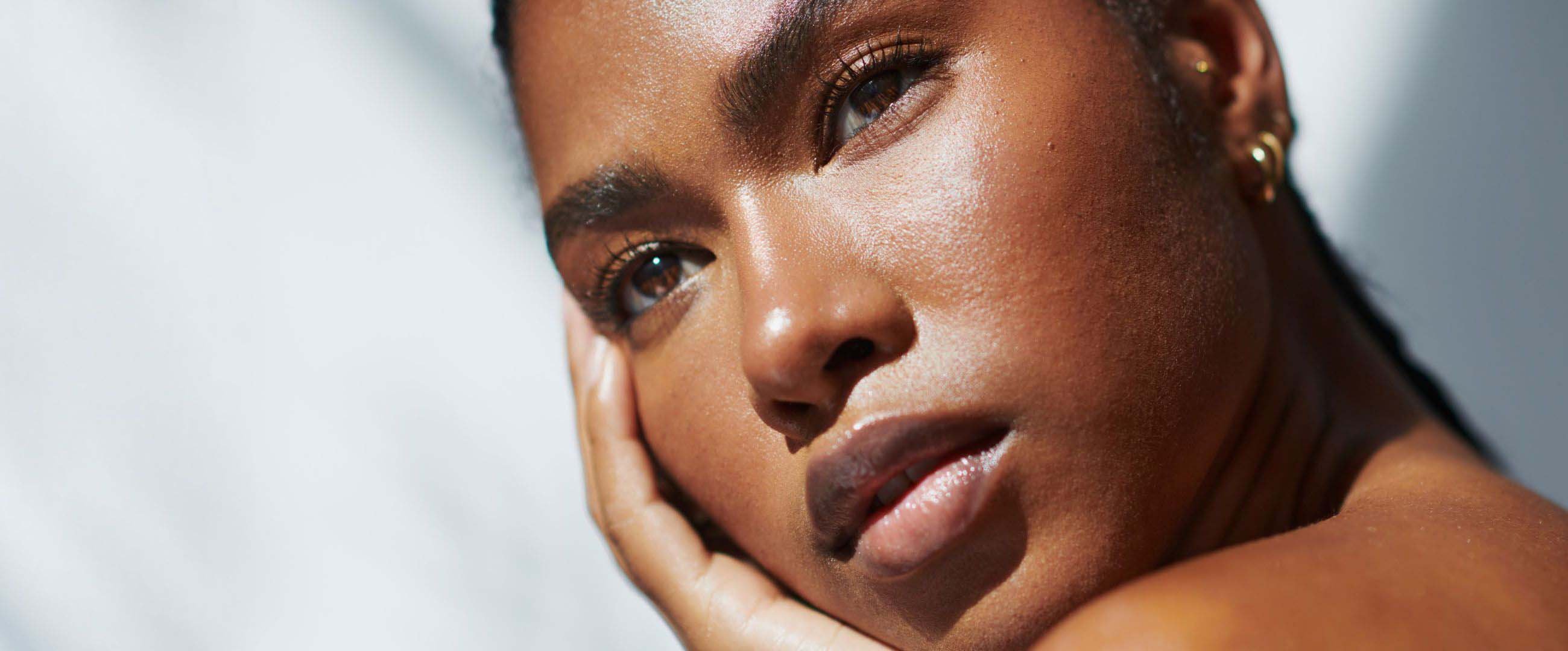 black woman with glowing skin close up